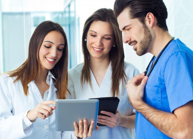 people looking at a tablet