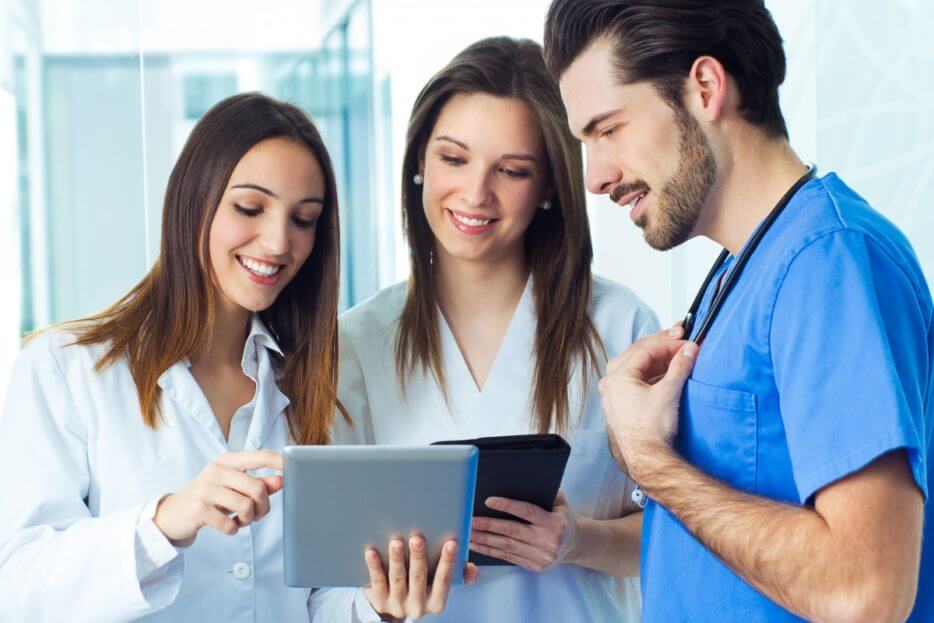 people looking at a tablet